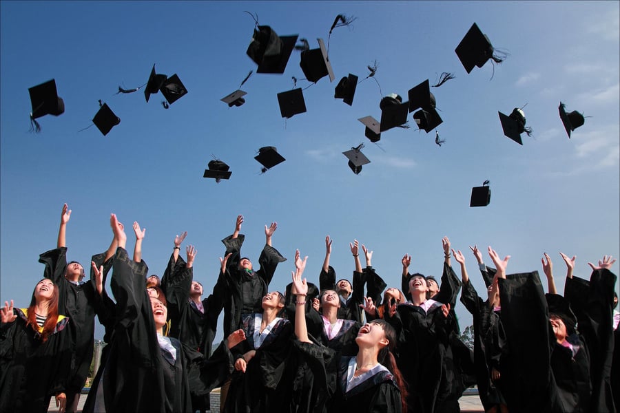 Graduated Students Throwing Hats